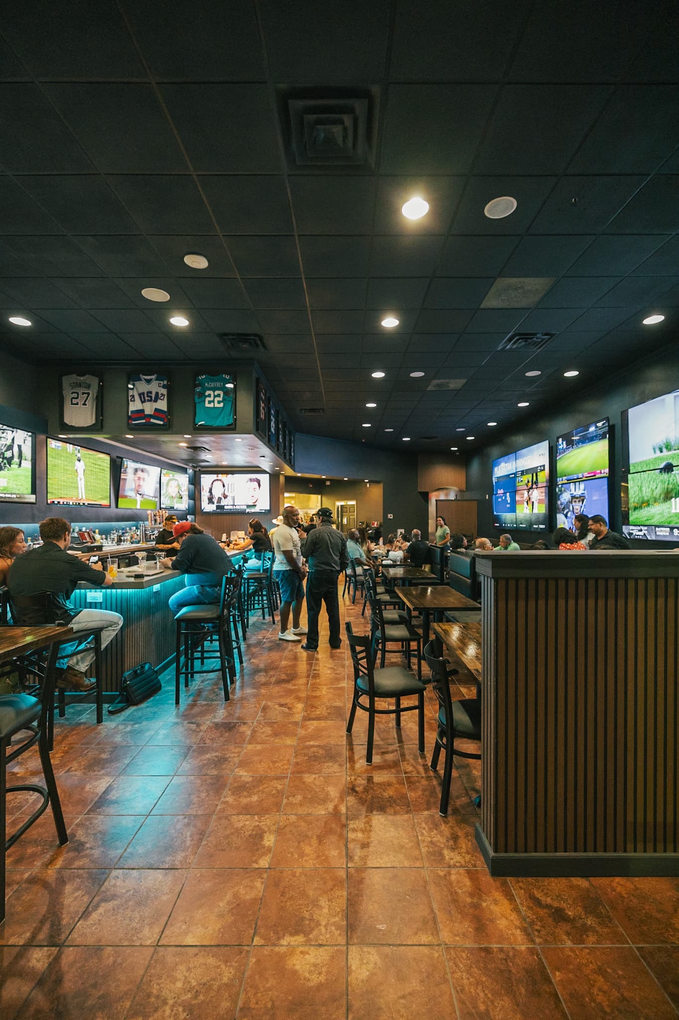 Down-the-line view of The Owner's Box bar and dining room