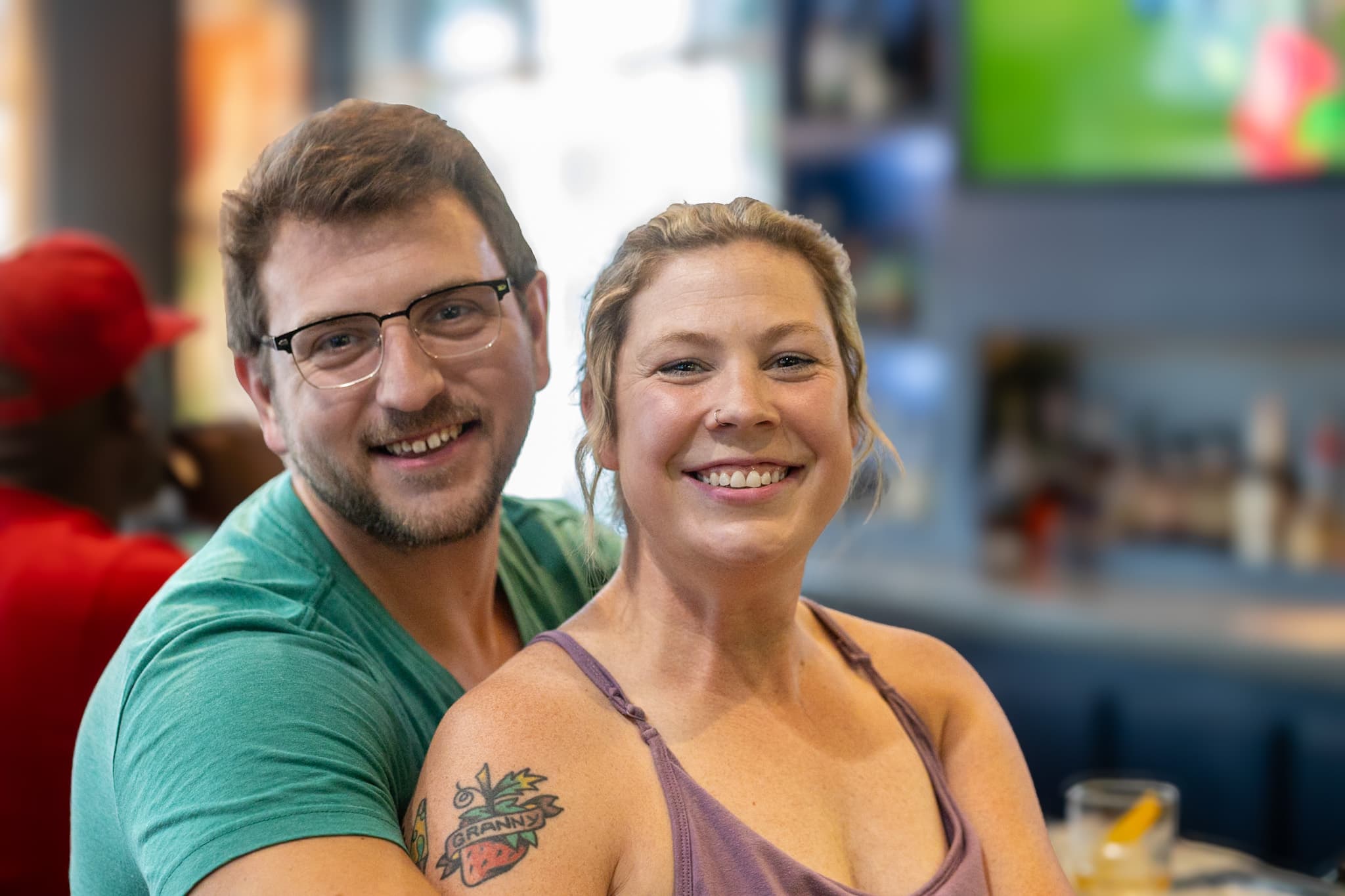 Guests smiling at the bar